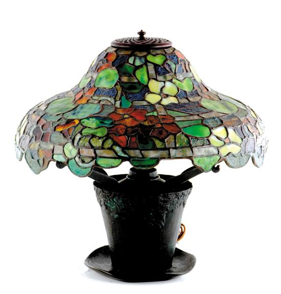 Appraisal: Art Nouveau style table lamp shaped floral shade in vibrant