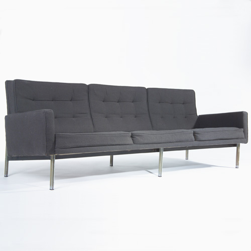 Appraisal: KNOLL Three-seat sofa with tufted black wool upholstery on parallel