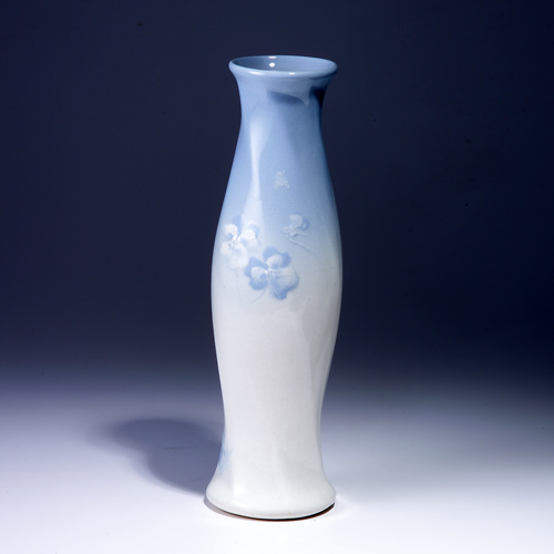 Appraisal: OWENS Lotus twisted and faceted vase painted with blue and