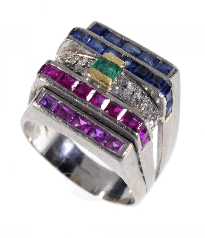 Appraisal: A DIAMOND EMERALD RUBY AND SAPPHIRE COCKTAIL RING mounted in