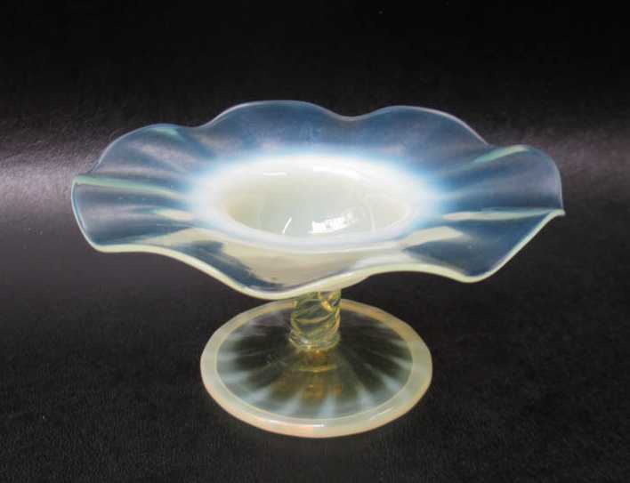 Appraisal: OPALESCENT ART GLASS COMPOTE in pastel yellow-green to clear circular