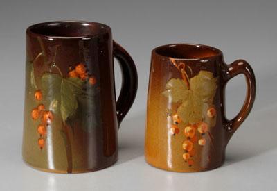 Appraisal: Two art pottery tankards one with cluster of grapes marked