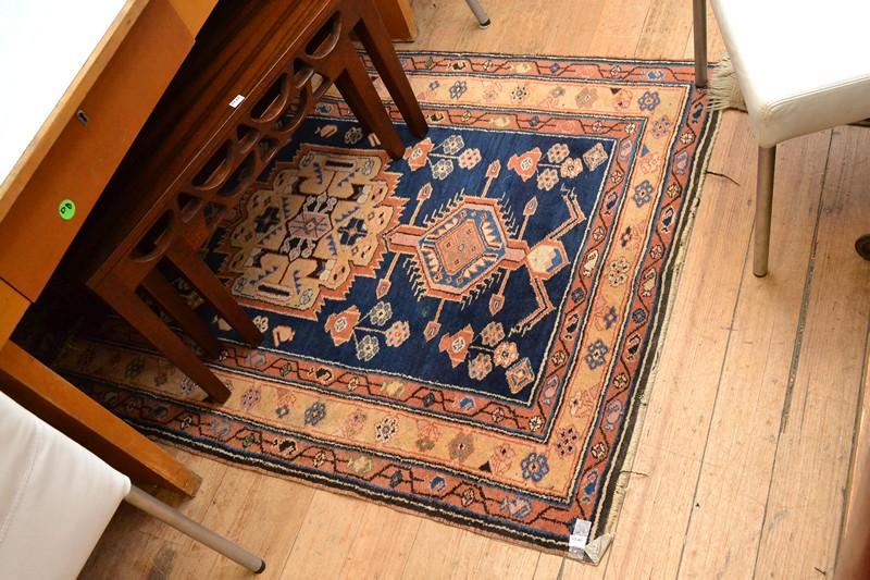 Appraisal: AFGHANI WOOLEN RUG IN NAVY AND BURNT ORANGE TONES AFGHANI