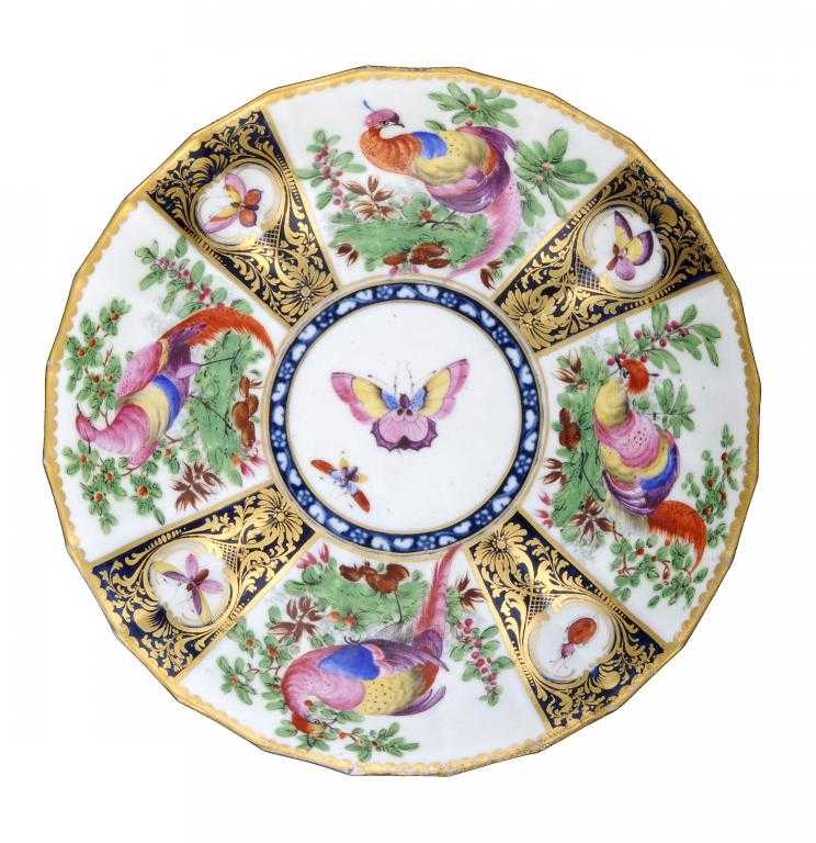 Appraisal: A WORCESTER FLUTED SAUCER-DISH boldly painted with four 'Fancy Birds'