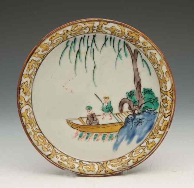 Appraisal: A JAPANESE LATE KO-KUTANI DISH figures in a ferry boat