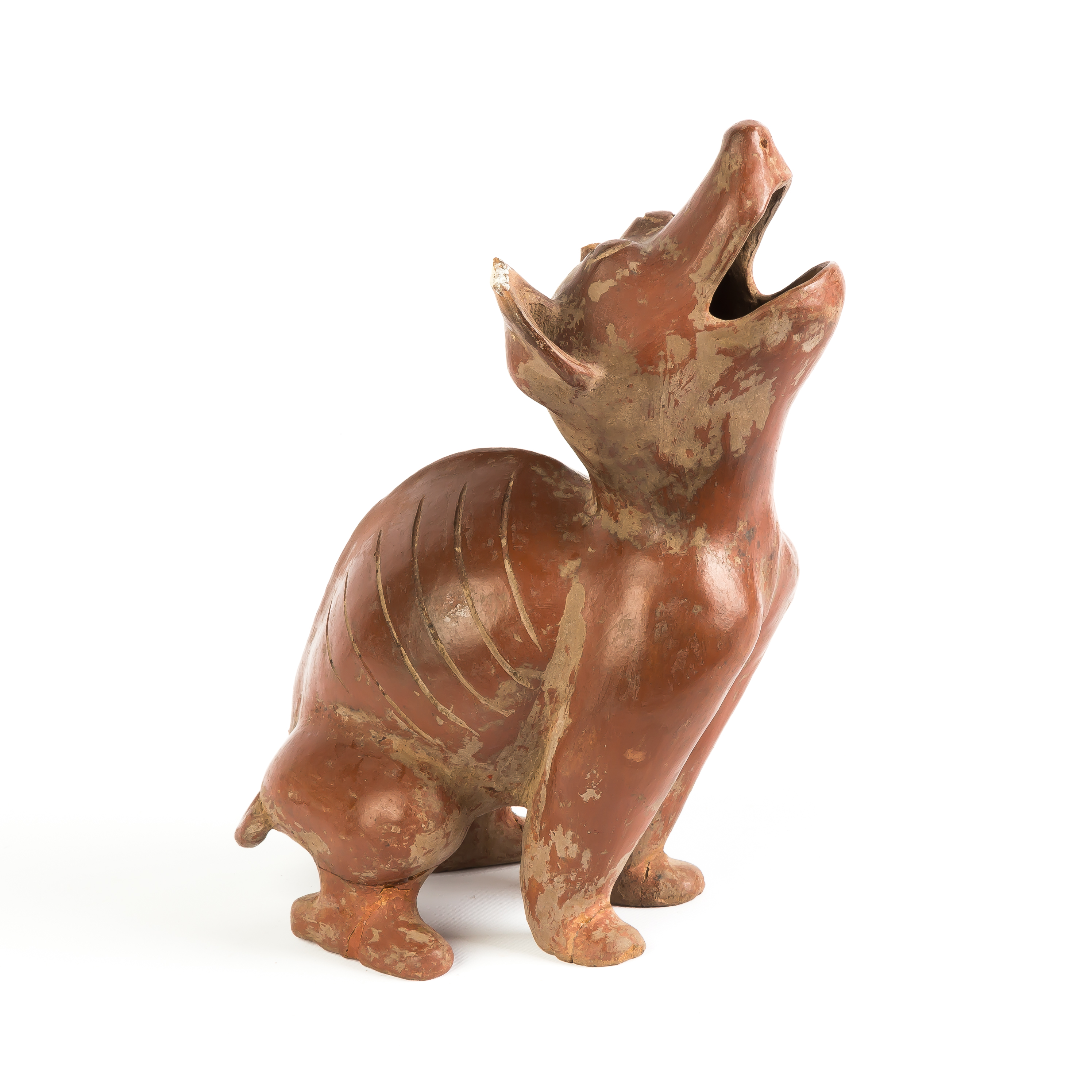 Appraisal: th Century Pottery Figure of a Squatting Dog th century