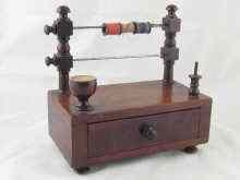 Appraisal: A th c sewing aid comprising a mahogany box on