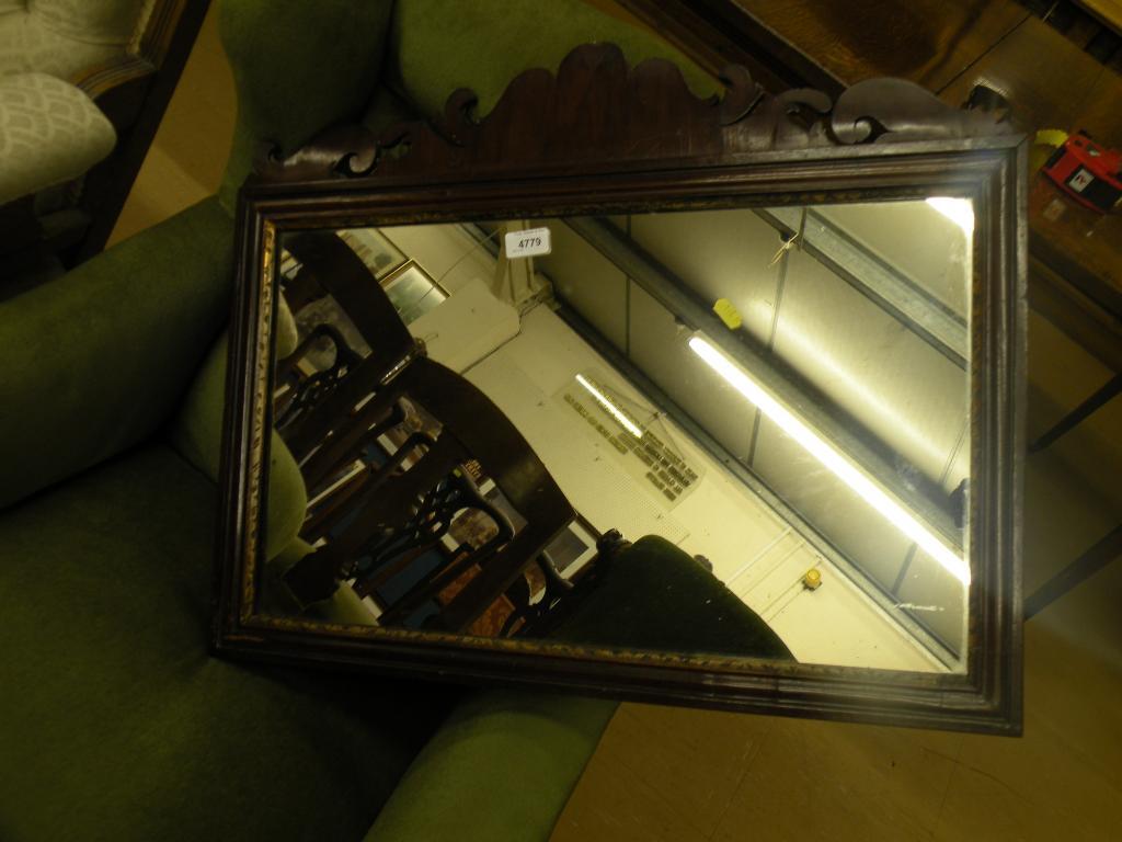 Appraisal: An thC walnut rectangular wall mirror with a pierced and