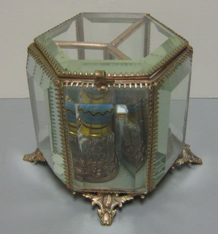 Appraisal: FRENCH PERFUME BOTTLE CASKET Gilt metal and beveled edge glass