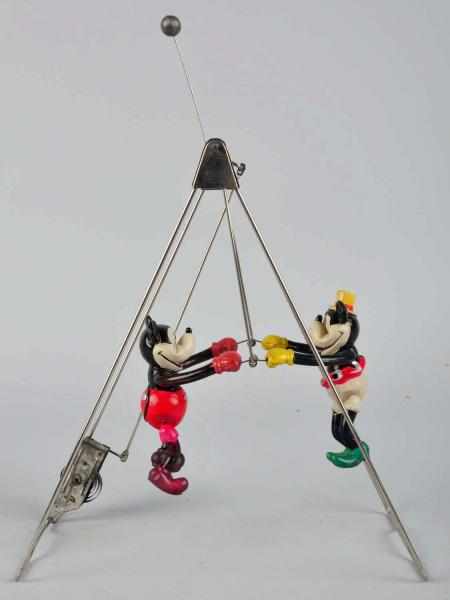 Appraisal: Celluloid Walt Disney Mickey Minnie Swing Toy Wind-up mechanism is