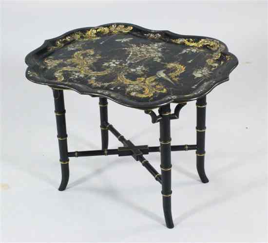 Appraisal: A Victorian papier mache tray top table decorated with gilding