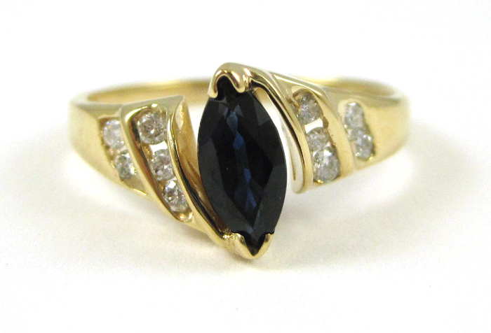 Appraisal: SAPPHIRE DIAMOND AND FOURTEEN KARAT GOLD RING with five round-cut