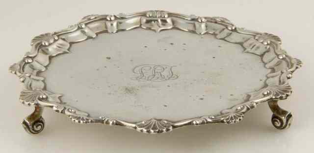 Appraisal: A circular silver waiter BB Birmingham with shell and C