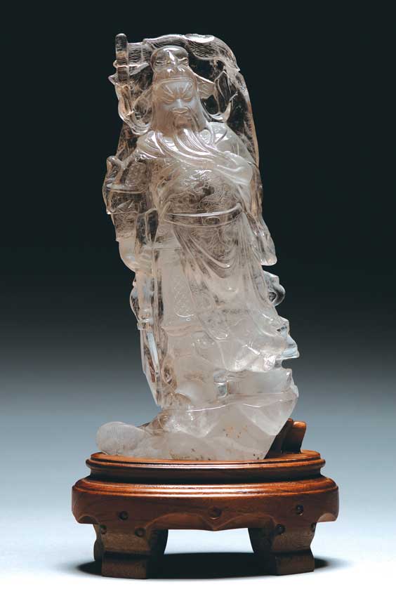 Appraisal: CARVED ROCK CRYSTAL GUANDI Finely carved Chinese rock crystal figure