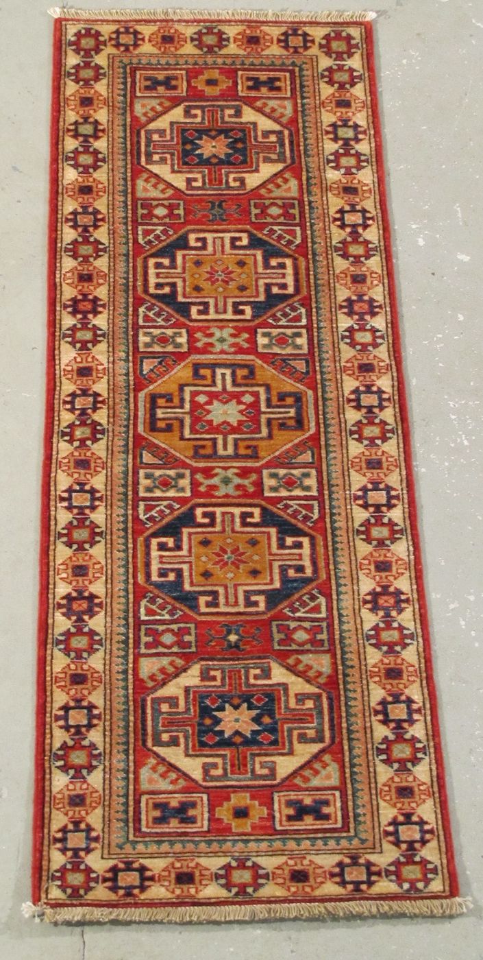 Appraisal: ORIENTAL RUG KAZAK DESIGN RUNNER ' x ' With five