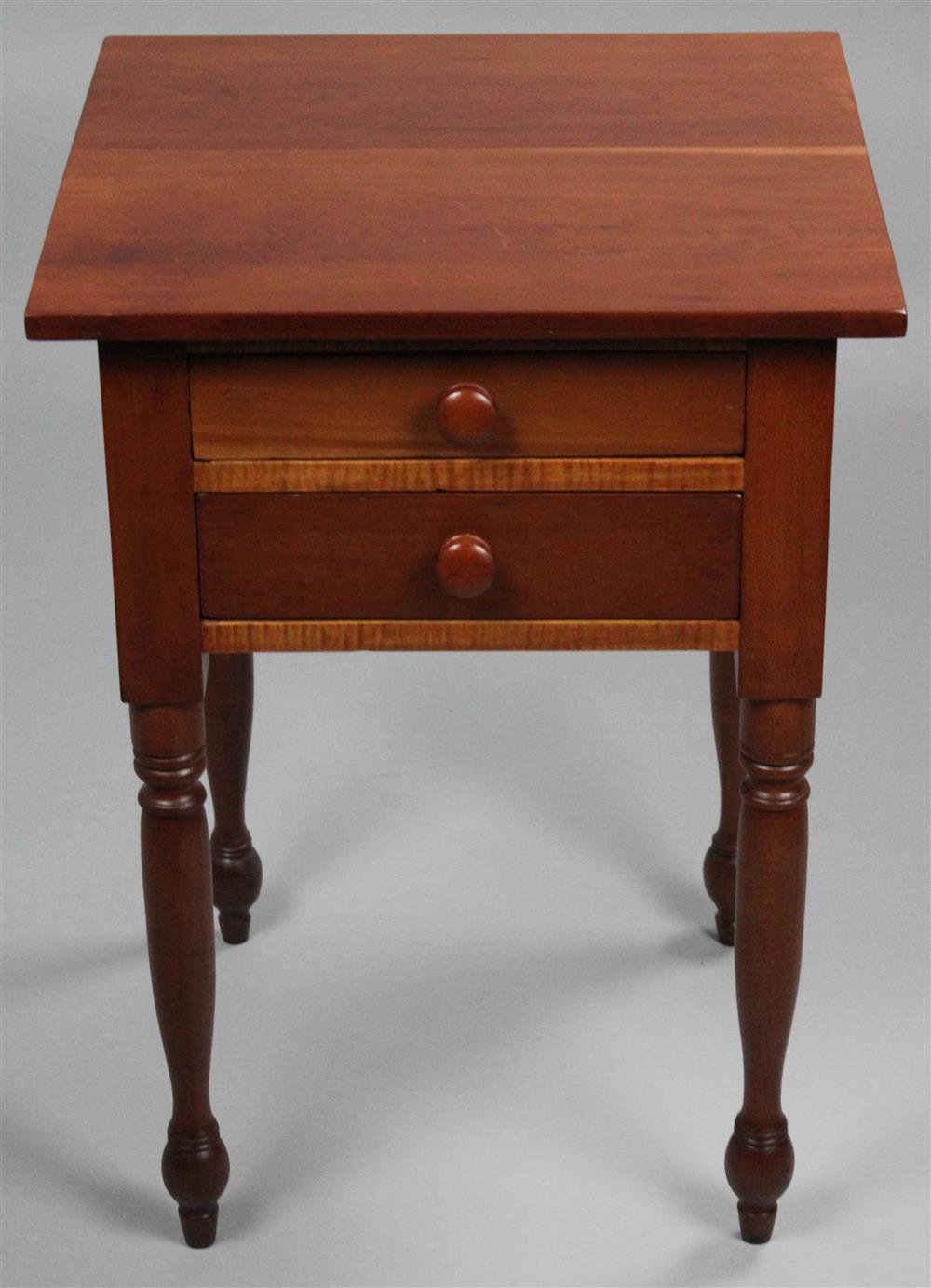 Appraisal: SHERATON CHERRY AND TIGER MAPLE TWO DRAWER WORK STAND the