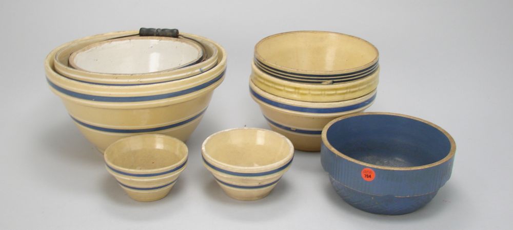 Appraisal: NINE CERAMIC BOWLS Seven yellowware bowls blue and white handled