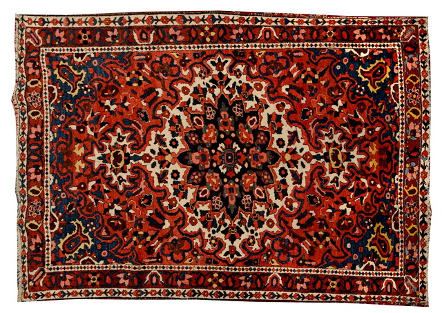 Appraisal: A BAKHTIARI RED GROUND RUG decorated a central large white