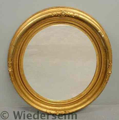 Appraisal: Oval gilt framed mirror c with mirror glass of a