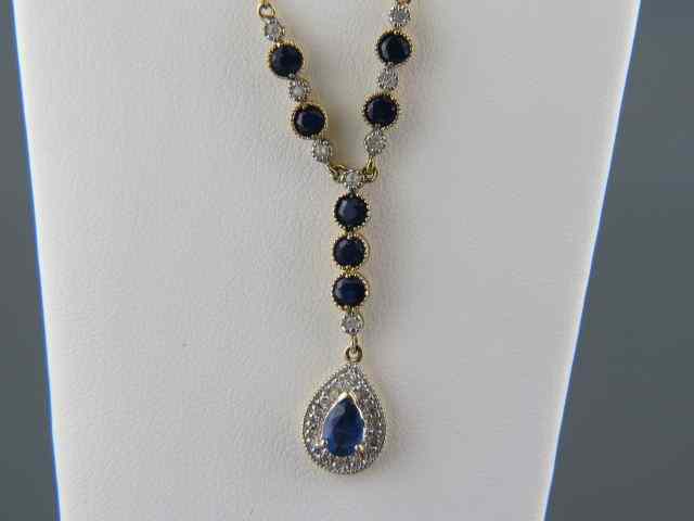 Appraisal: Sapphire Diamond Necklace round pear shape deep blue gems diamonds