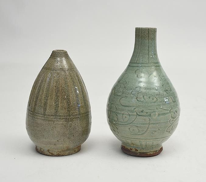 Appraisal: Two early Chinese celadon glazed and carved design vases Two