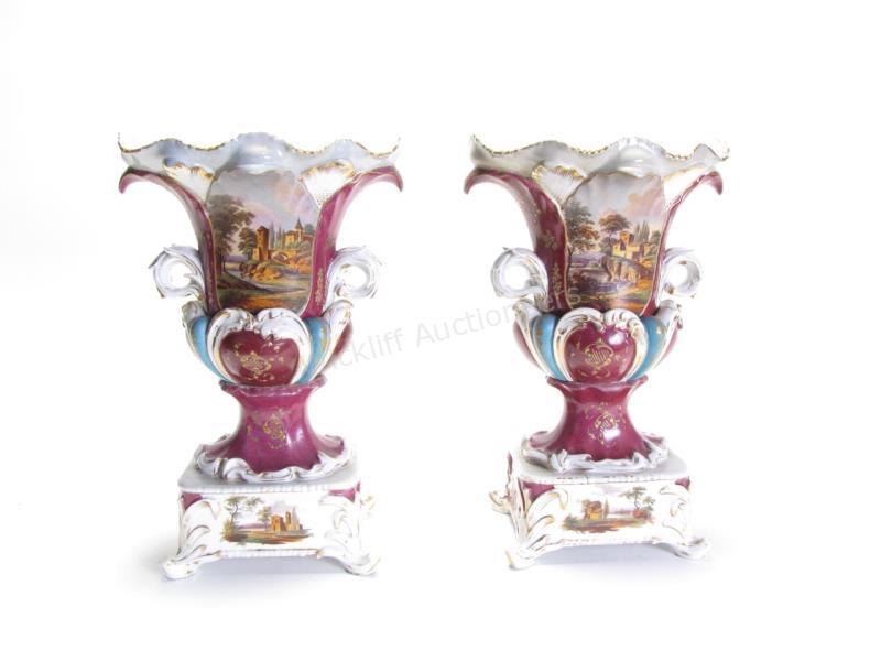 Appraisal: A pair of antique Italian porcelain urns unmarked with handpainted