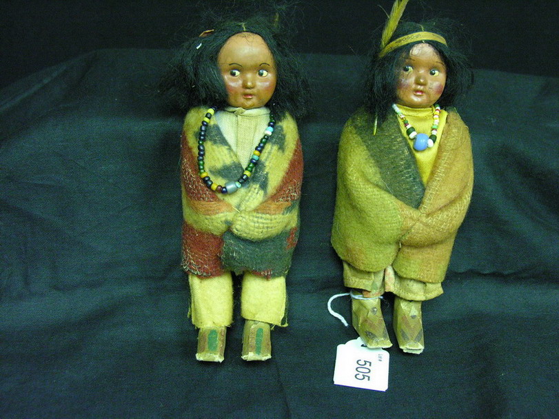 Appraisal: PAIR SKOOKUM INDIAN DOLLS Composition head paper boots are hand