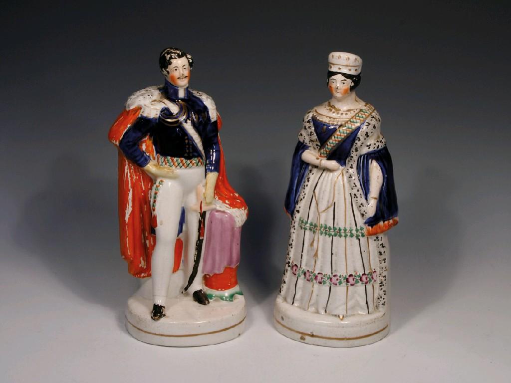 Appraisal: A PAIR OF STAFFORDSHIRE POTTERY FIGURES of the young Queen