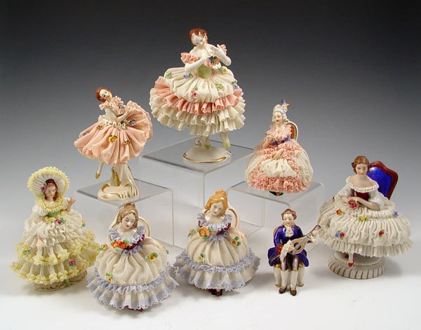 Appraisal: DRESDEN AND DRESDEN TYPE GERMAN PORCELAIN LACY FIGURES Woman in