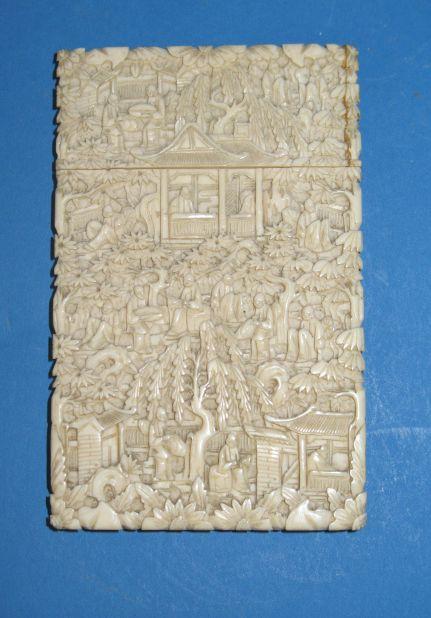 Appraisal: A CHINESE IVORY CARD CASE of rectangular form carved in