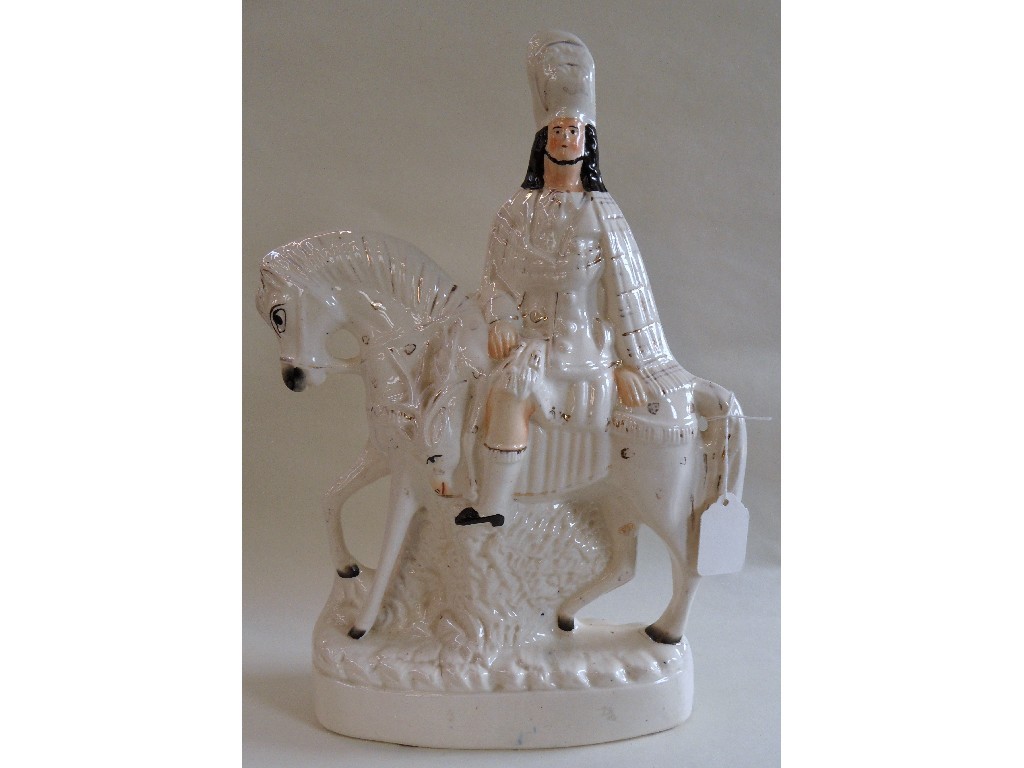 Appraisal: Staffordshire figure of a Highland man on horseback