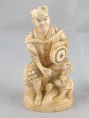 Appraisal: An ivory figure circa 's of an entertainer with drum