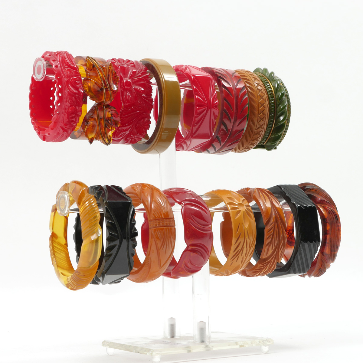 Appraisal: BAKELITE BRACELETS Bright collection of Bakelite bracelets with beautiful carved