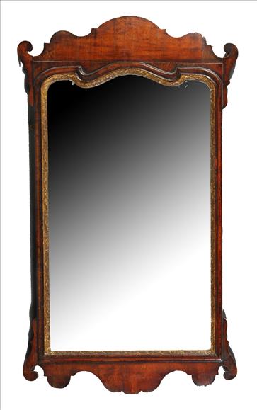 Appraisal: A George II walnut and parcel gilt wall mirror circa