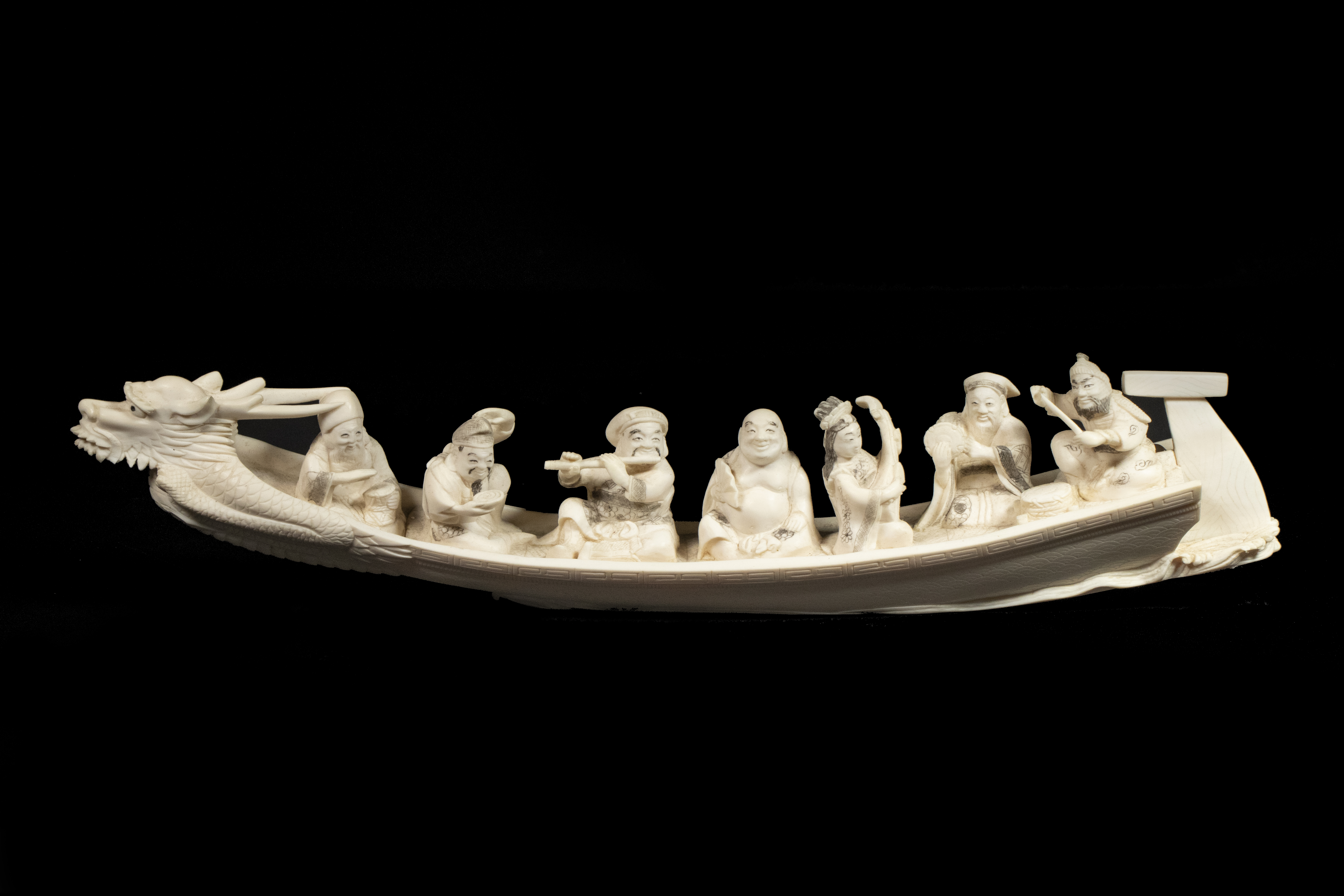 Appraisal: TH C JAPANESE IVORY OKIMONO OF A BOAT WITH FIGURES