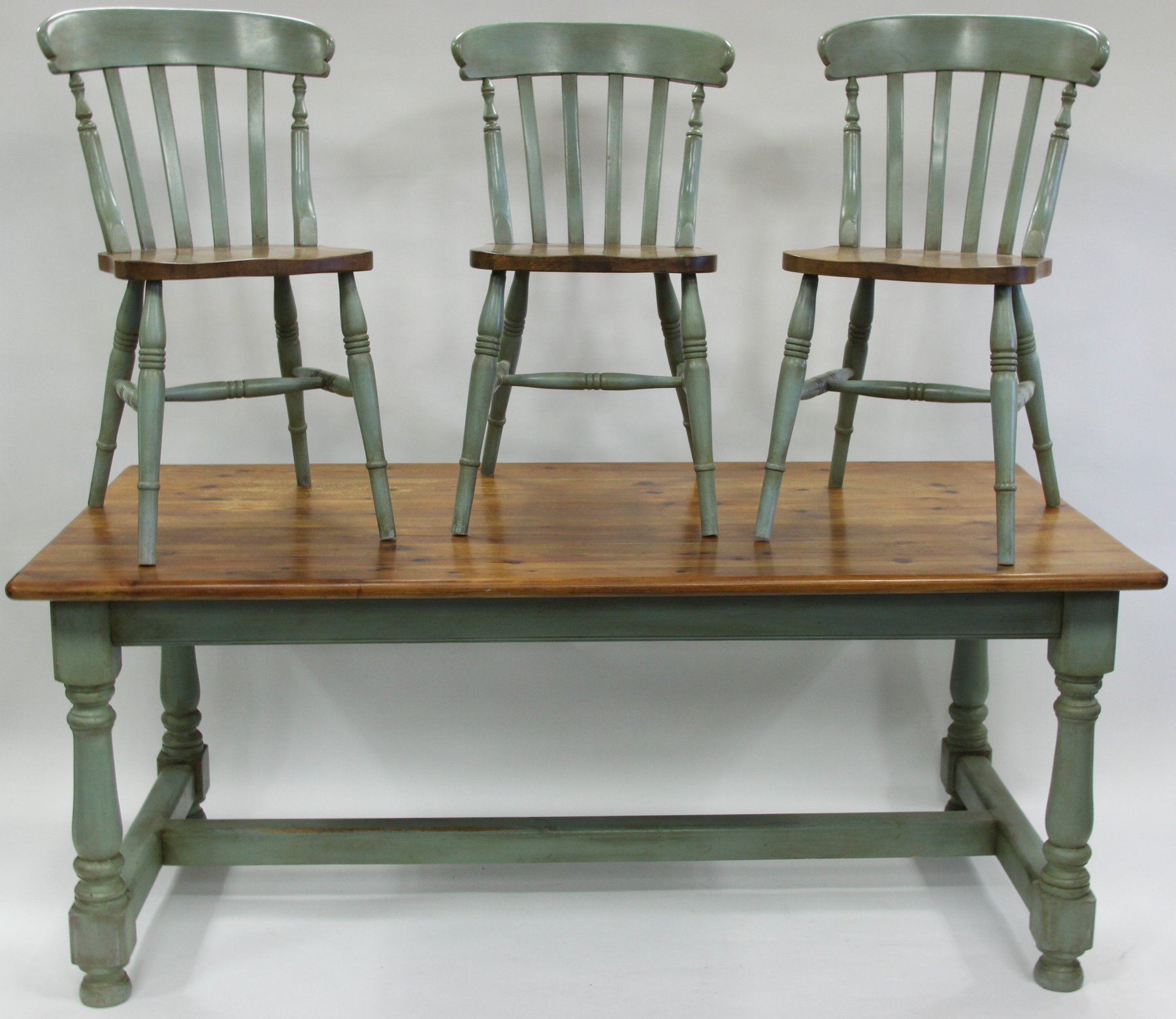 Appraisal: A painted pine kitchen table on turned legs united by