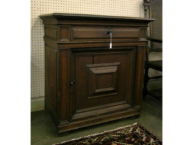 Appraisal: th century cupboard base with raised panels and one drawer