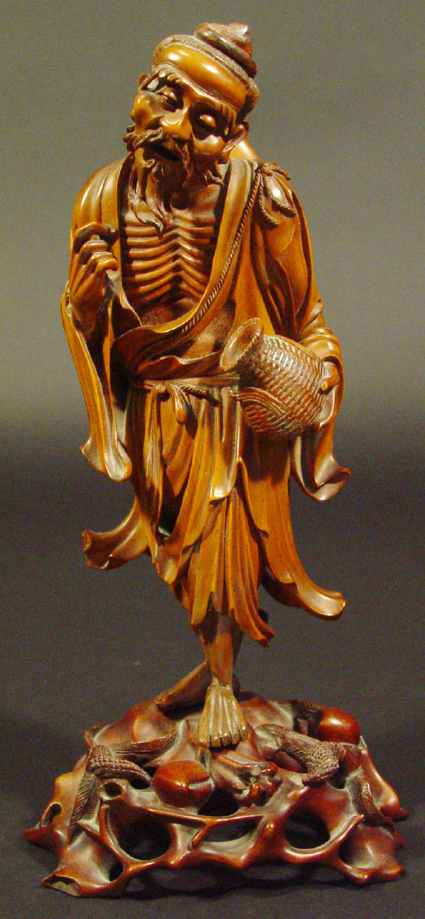 Appraisal: Oriental hardwood carving of an elder clutching a vase cm