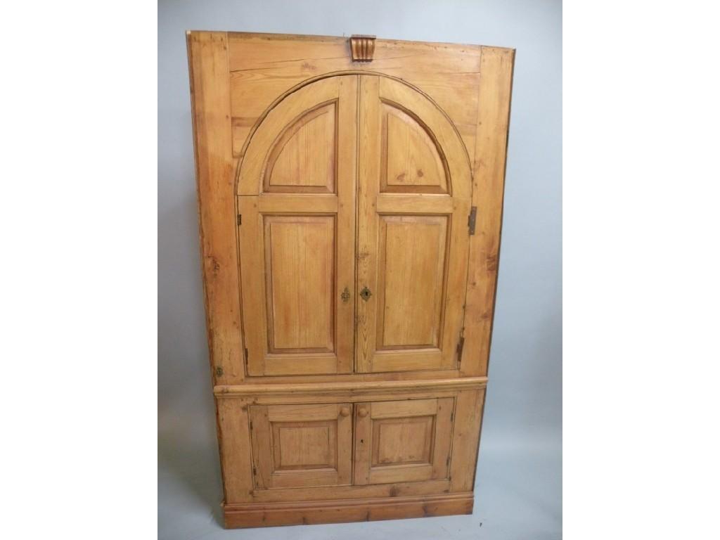 Appraisal: A pine corner cabinet with a domed centre section above