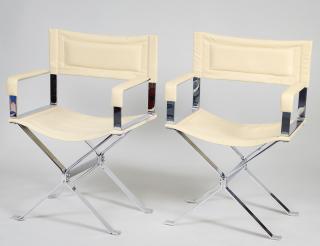 Appraisal: TWO LEATHER AND CHROMED STEEL ARMCHAIRS - The leather backs