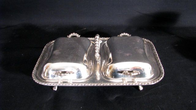 Appraisal: Group of silverplate table serving items including double covered condiment