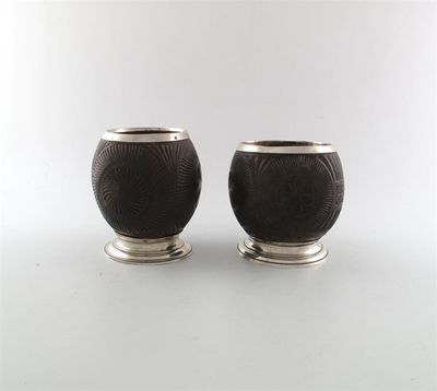 Appraisal: A pair of th century mounted coconut cups in the