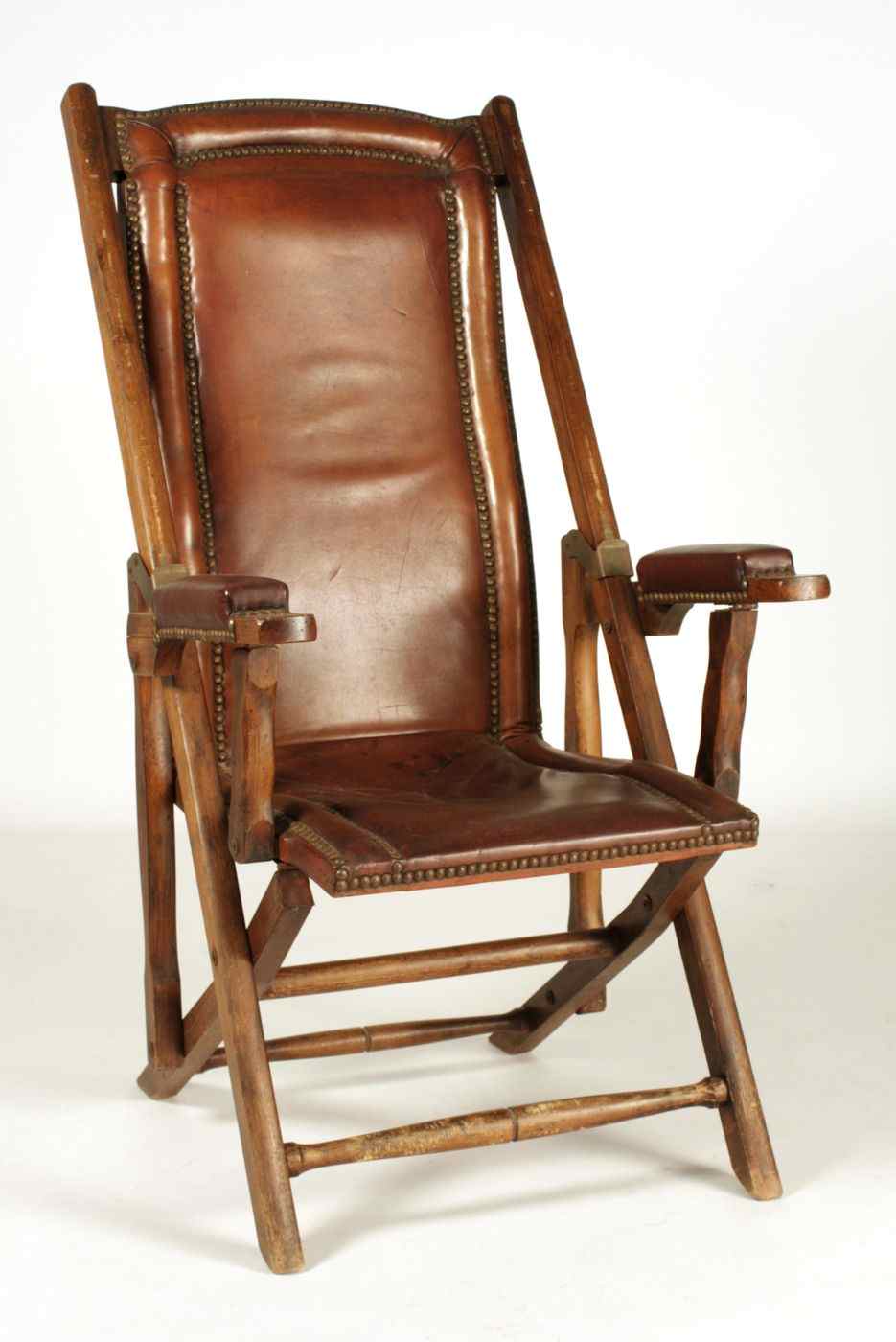 Appraisal: REPRODUCTION TH CENTURY ENGLISH OFFICER'S FIELD CHAIRWith brown leather upholstery