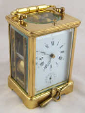 Appraisal: A brass cased half hour repeater alarm carriage clock the