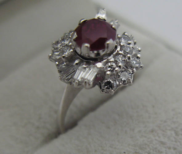 Appraisal: RUBY DIAMOND AND K WHITE GOLD RING Round-cut and baguette