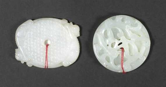 Appraisal: A WHITE AND A LIGHT GREEN JADE BI DISC China