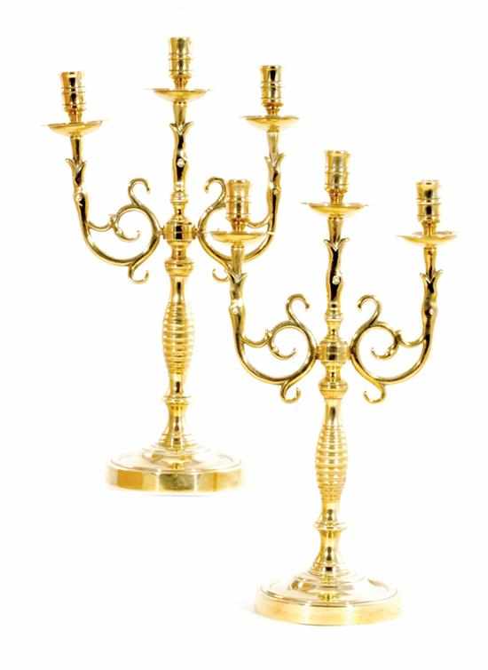 Appraisal: Pair Continental brass three-light candelabra circa Flemish form with scrolling