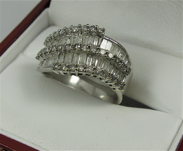 Appraisal: DIAMOND AND K WHITE GOLD RING the top half of