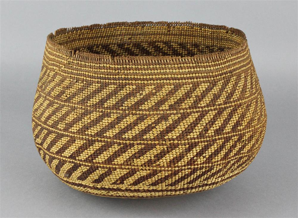 Appraisal: CALIFORNIA TWINED BASKETRY BOWL KAROK golden yellow and reddish brown