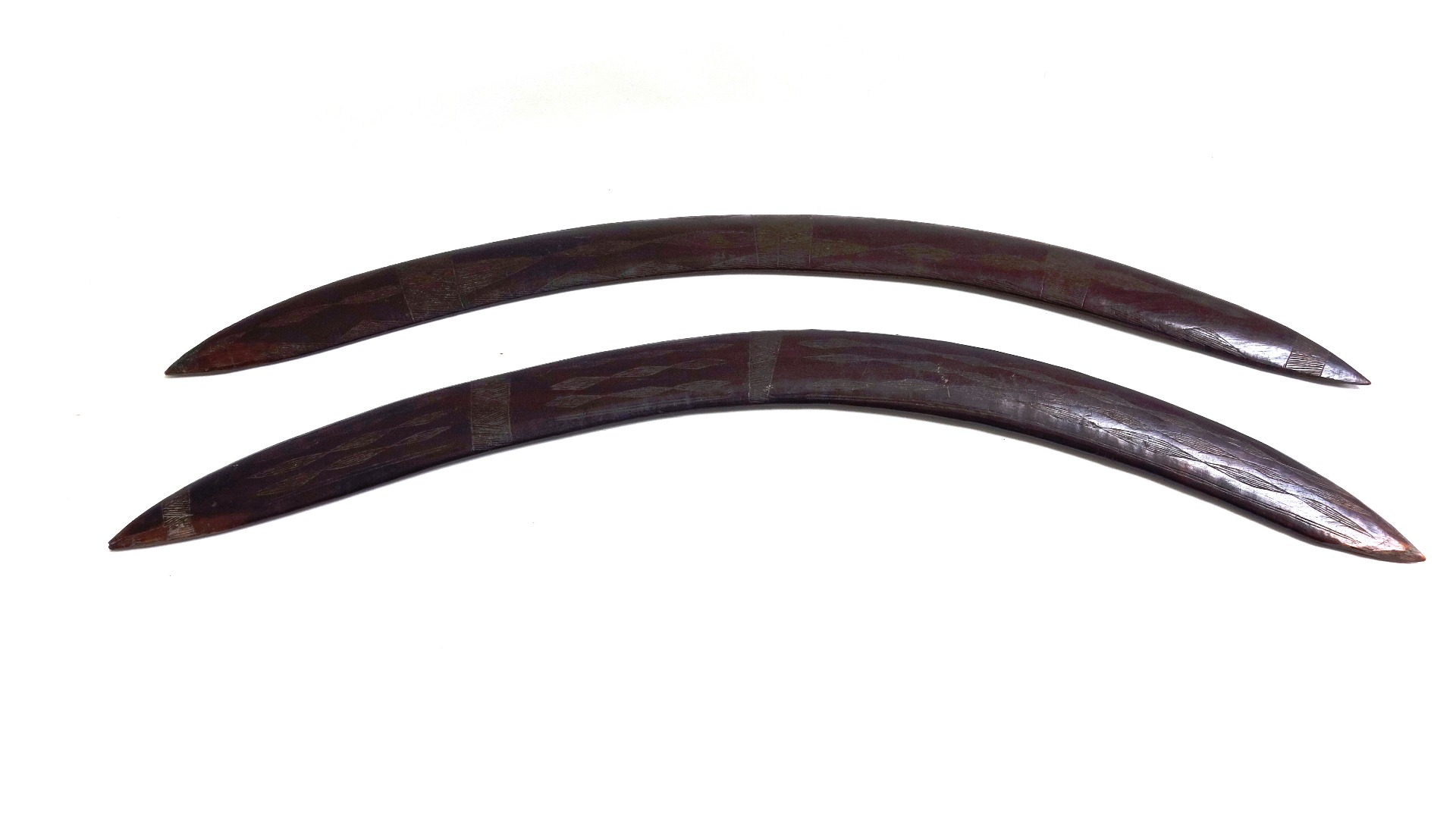 Appraisal: Two Australian Aboriginal boomerangs early th century carved with geometric